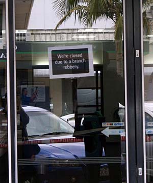 Sign saying "We're closed due to a branch robbery"