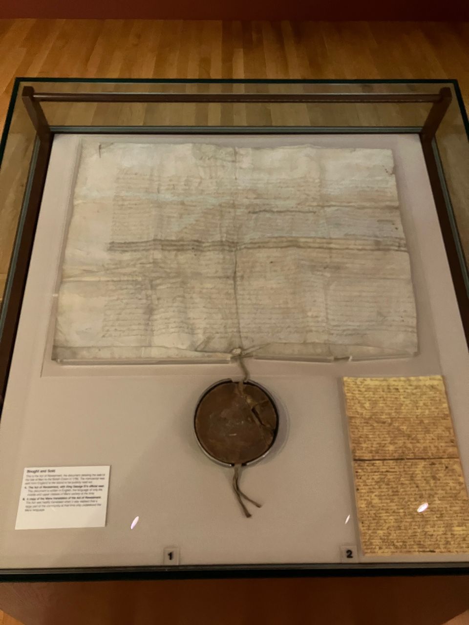Exhibit from the Manx museum of the original sheet of Act of Isle of Man Purchase Act 1765. It's written in longhand in  