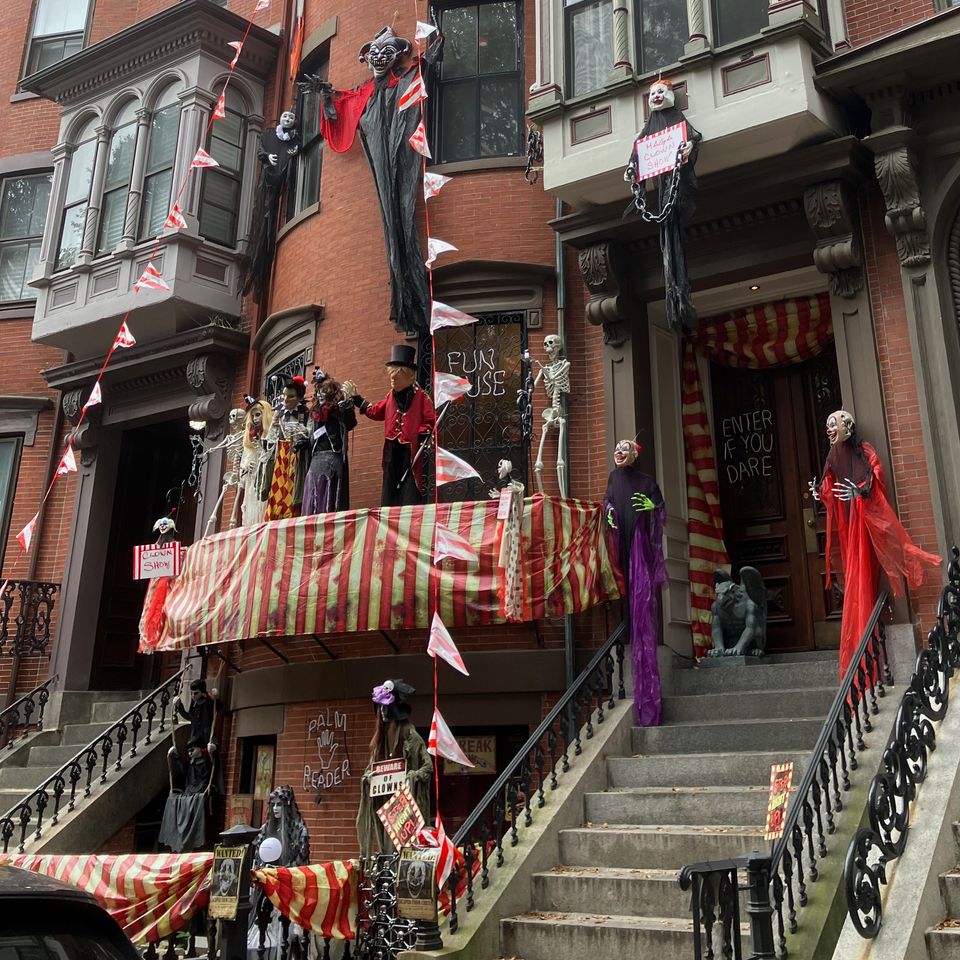 Boston doorstep with many decorations - including fun house, skeletons, various dolls and clowns