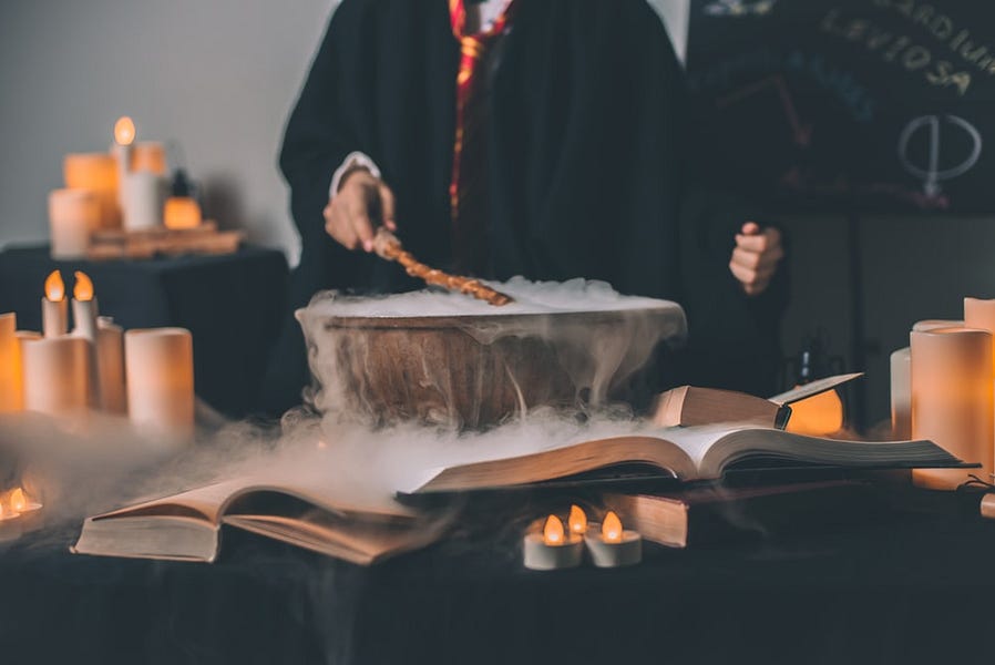 person holding wand on top of bowl